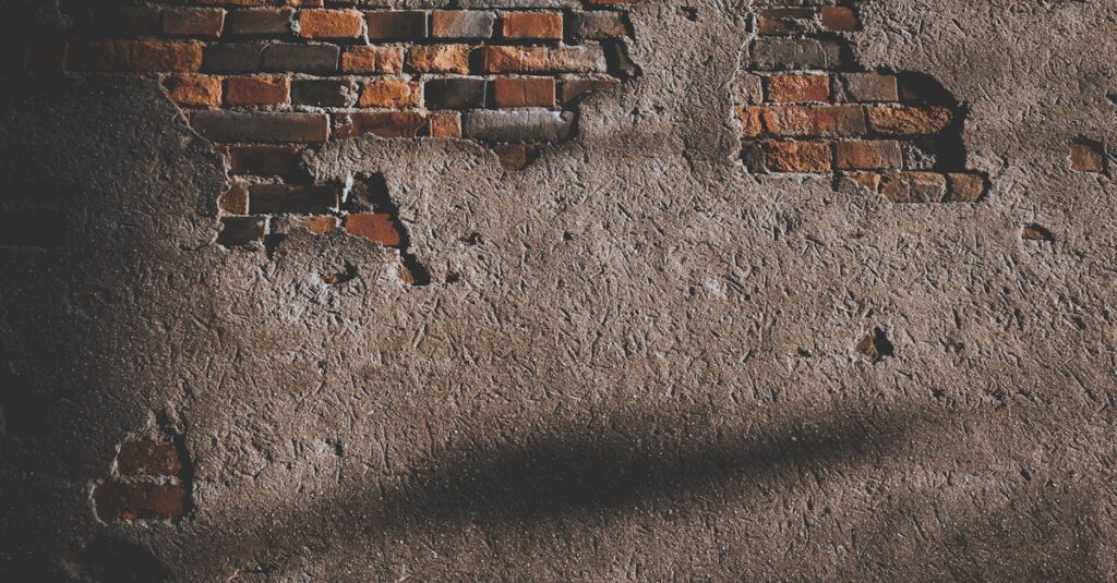 A vintage brick wall with exposed texture, ideal for background use.